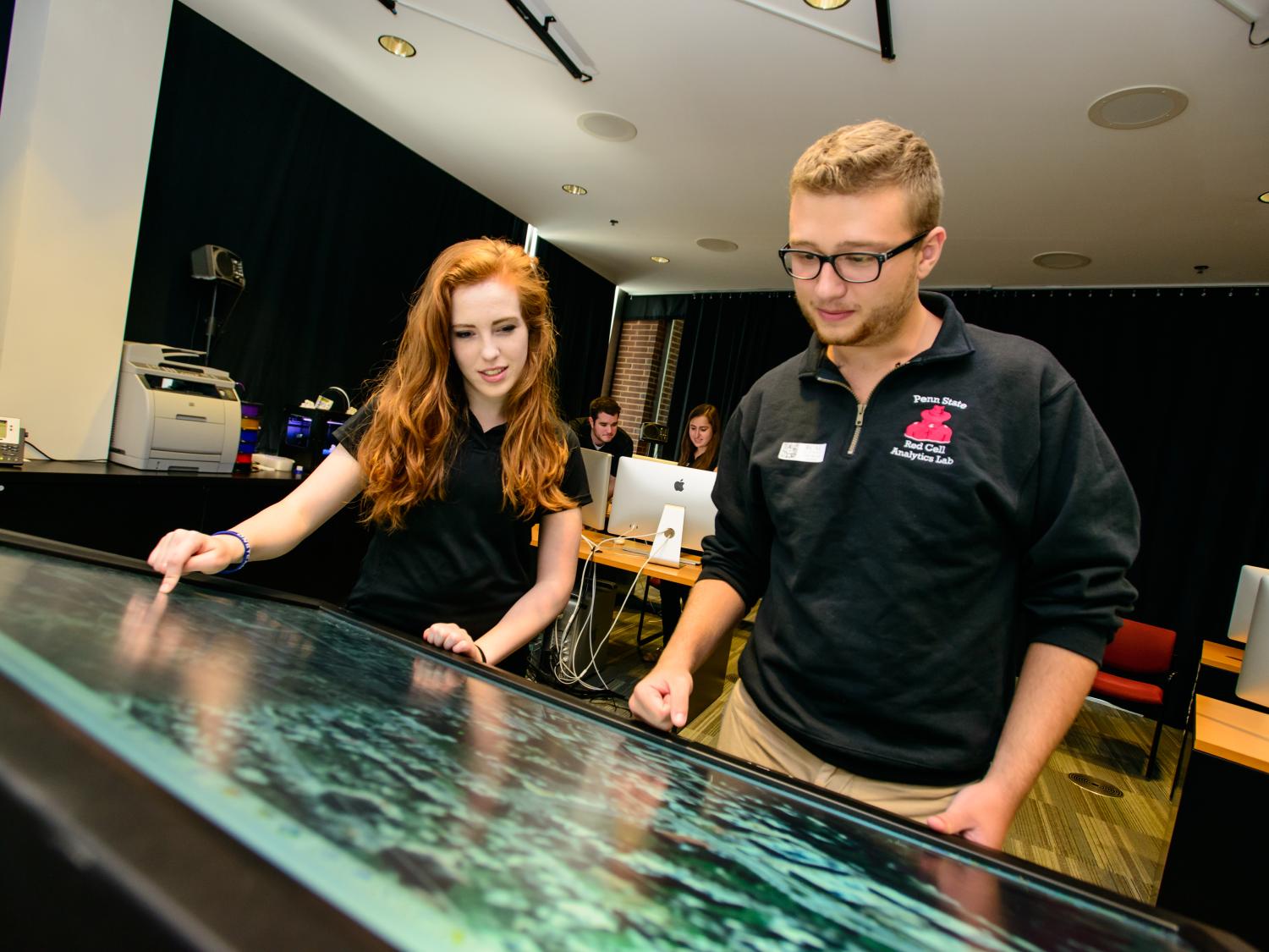 Students in the College of Information Sciences and Technology participate in hands-on experiences in the Extreme Events Lab.