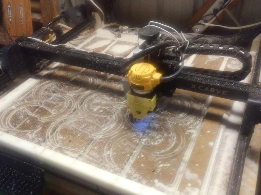 Face shield brackets being cut in a machine