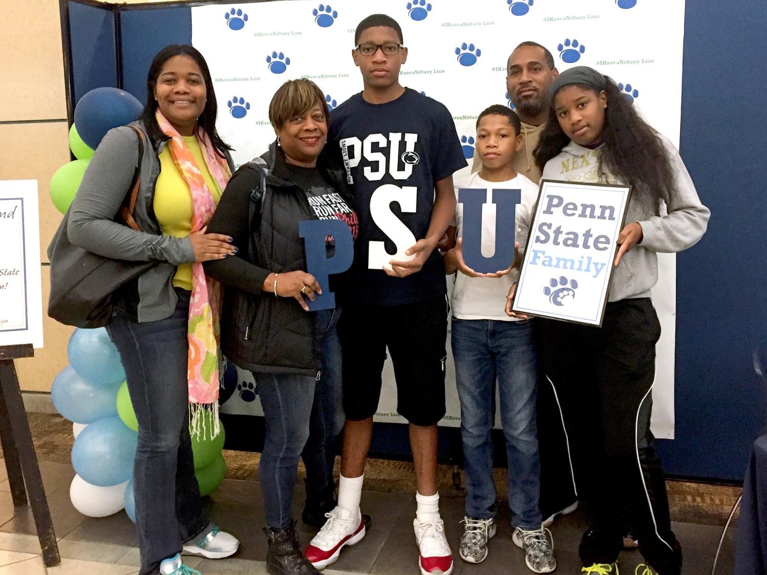 Family in photo booth for Parents & Families Weekend 2016