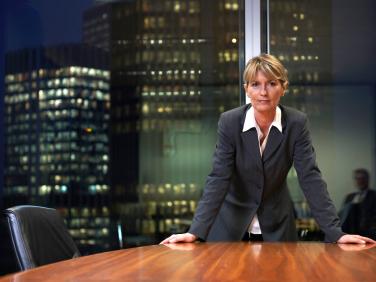 woman standing at conference table