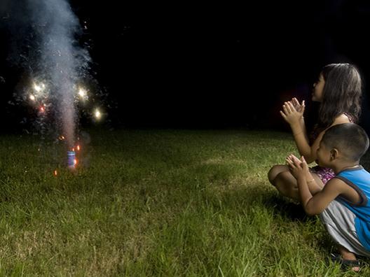 Children watching ground sparklers