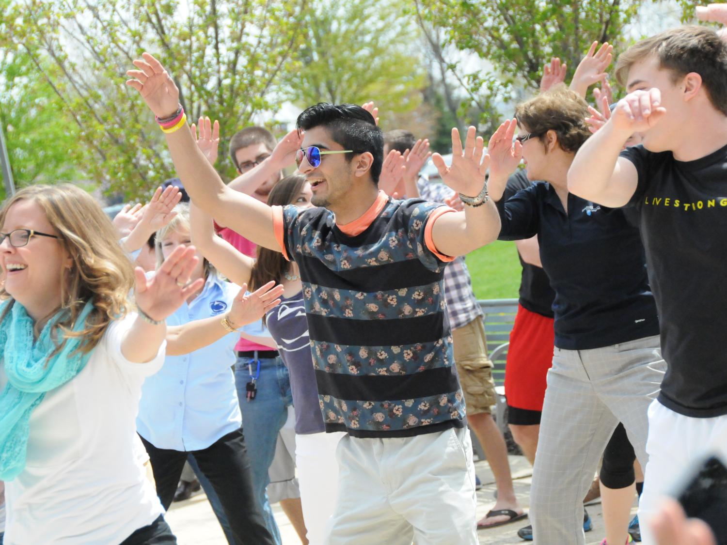 students, faculty, and staff dance