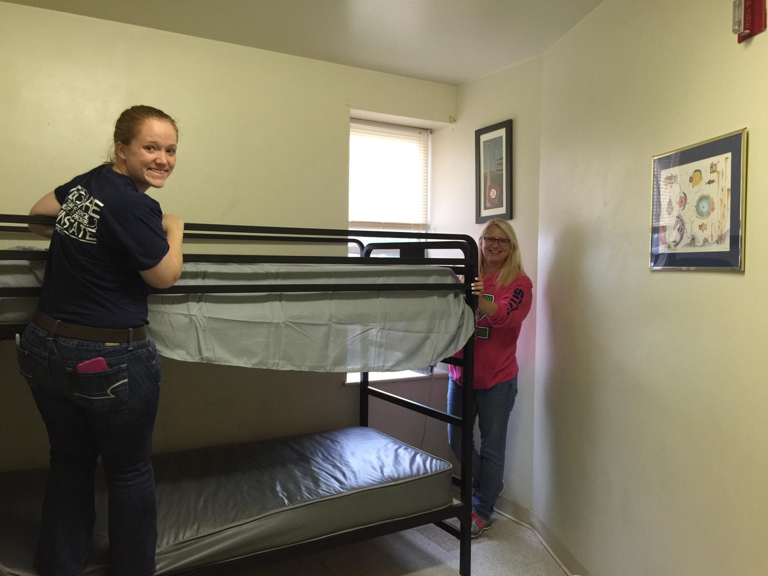 Students clean bunk beds