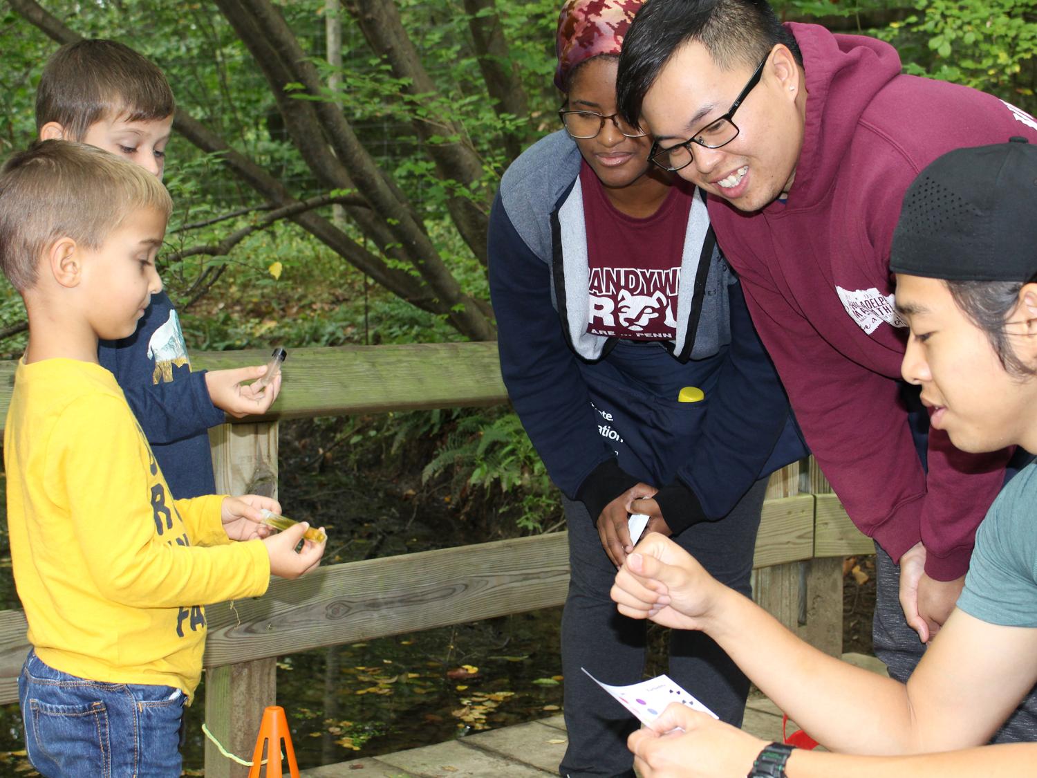 Penn State Brandywine students teaching children at Tyler Arboretum. 