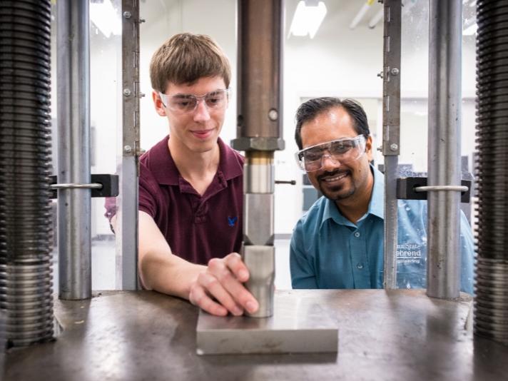 A professor works with a student in an engineering lab at Penn State Behrend.