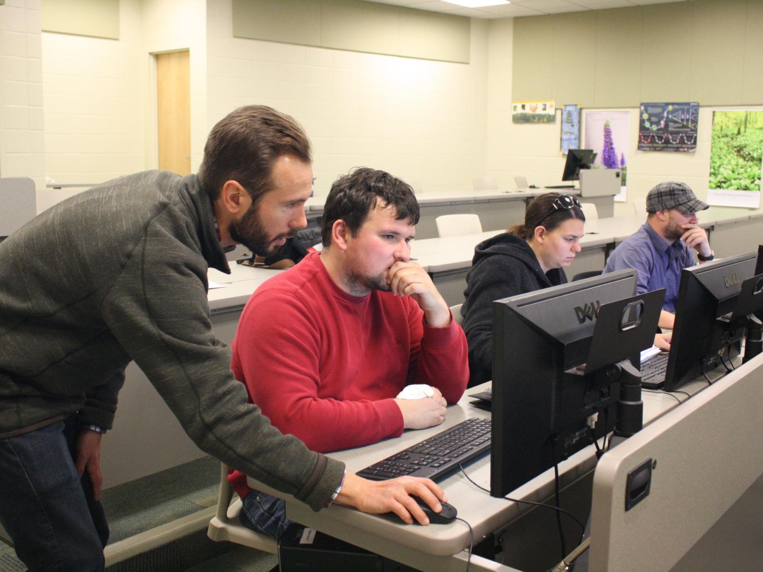 Instructor in Earth Sciences Patrick Applegate guides student James Greenawalt