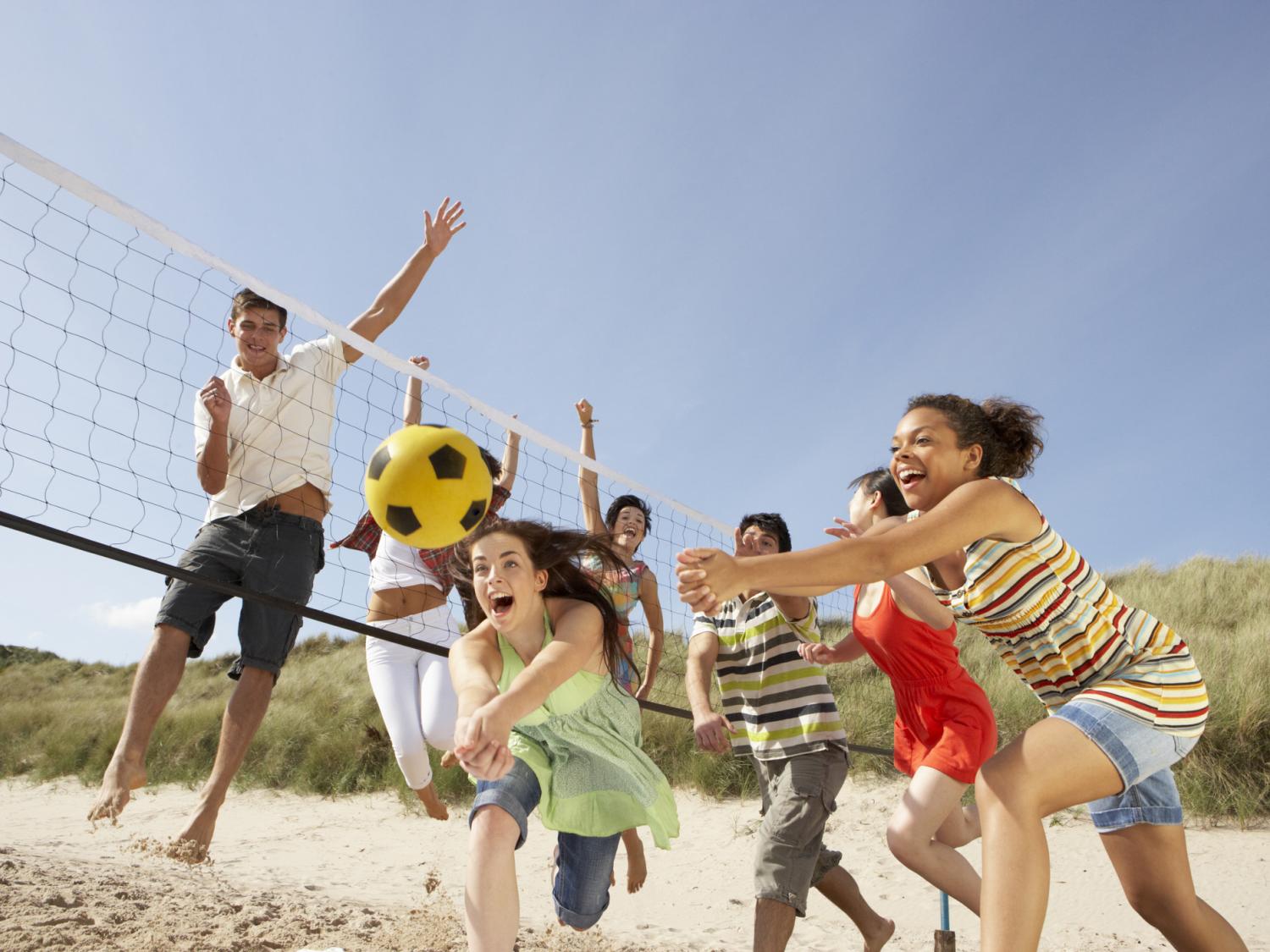 teens playing vollyball