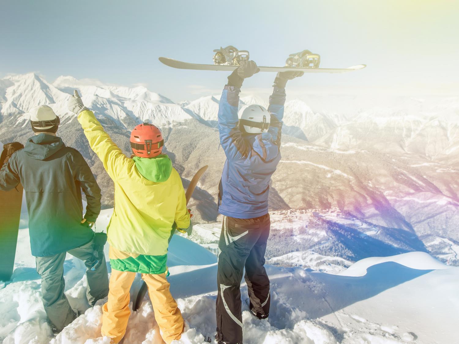Snowboarders at top of mountain