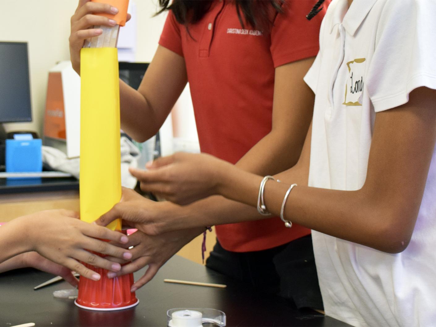 Students work on a project as part of Girls Code the World program