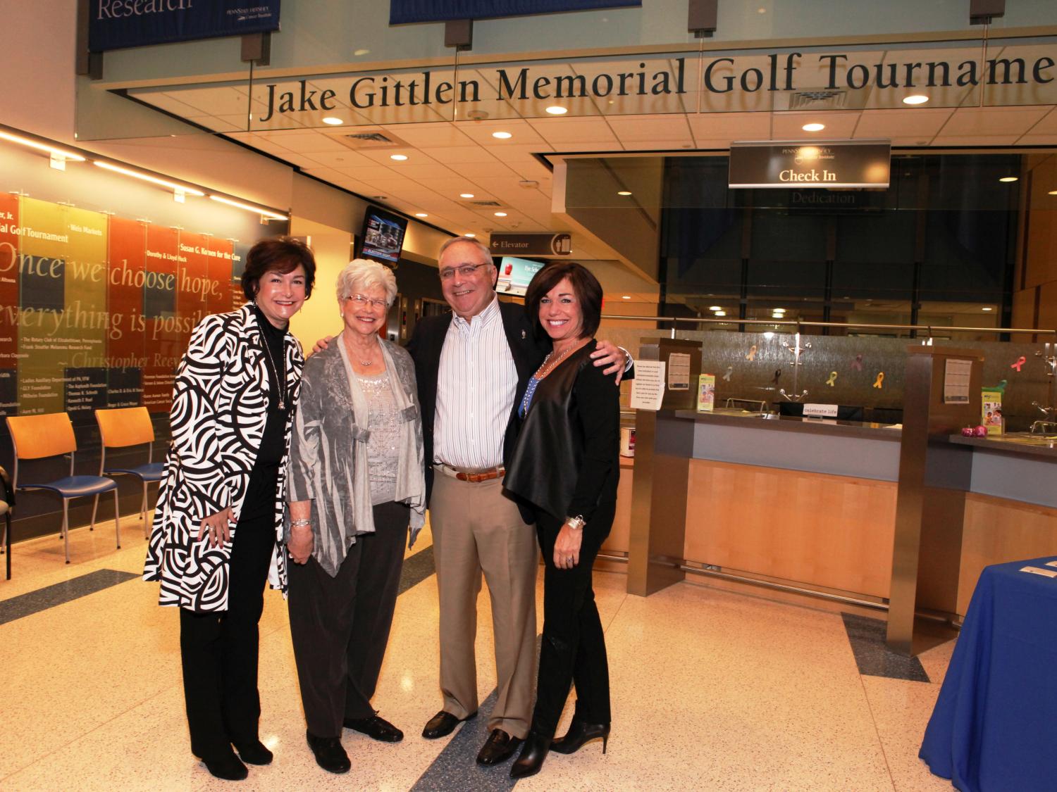 Warren Gittlen poses with others at the Gittlen lobby dedication.