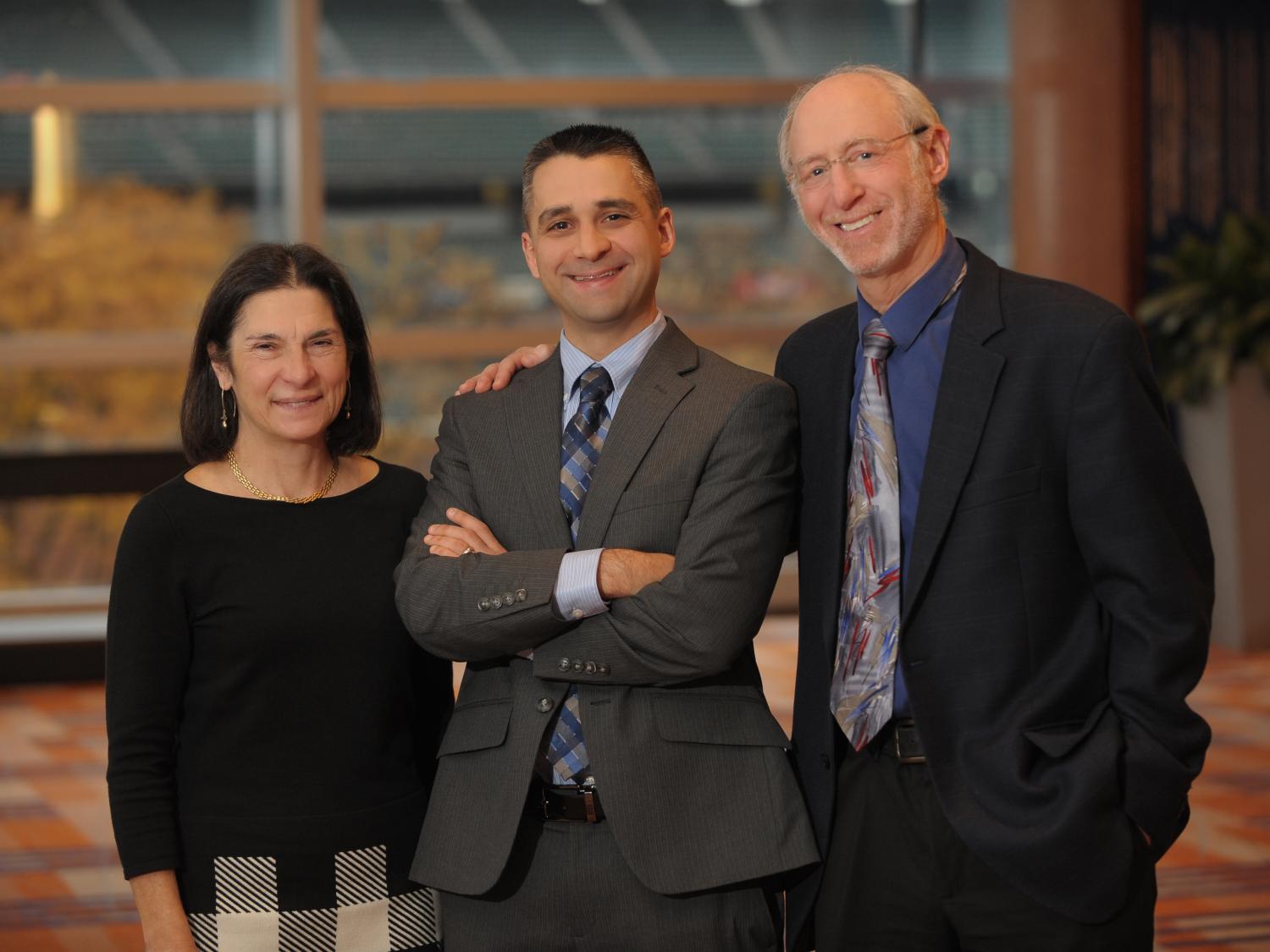 Drs. Terry Wolpaw, Jed Gonzalo and Dan Wolpaw pose for a photo.