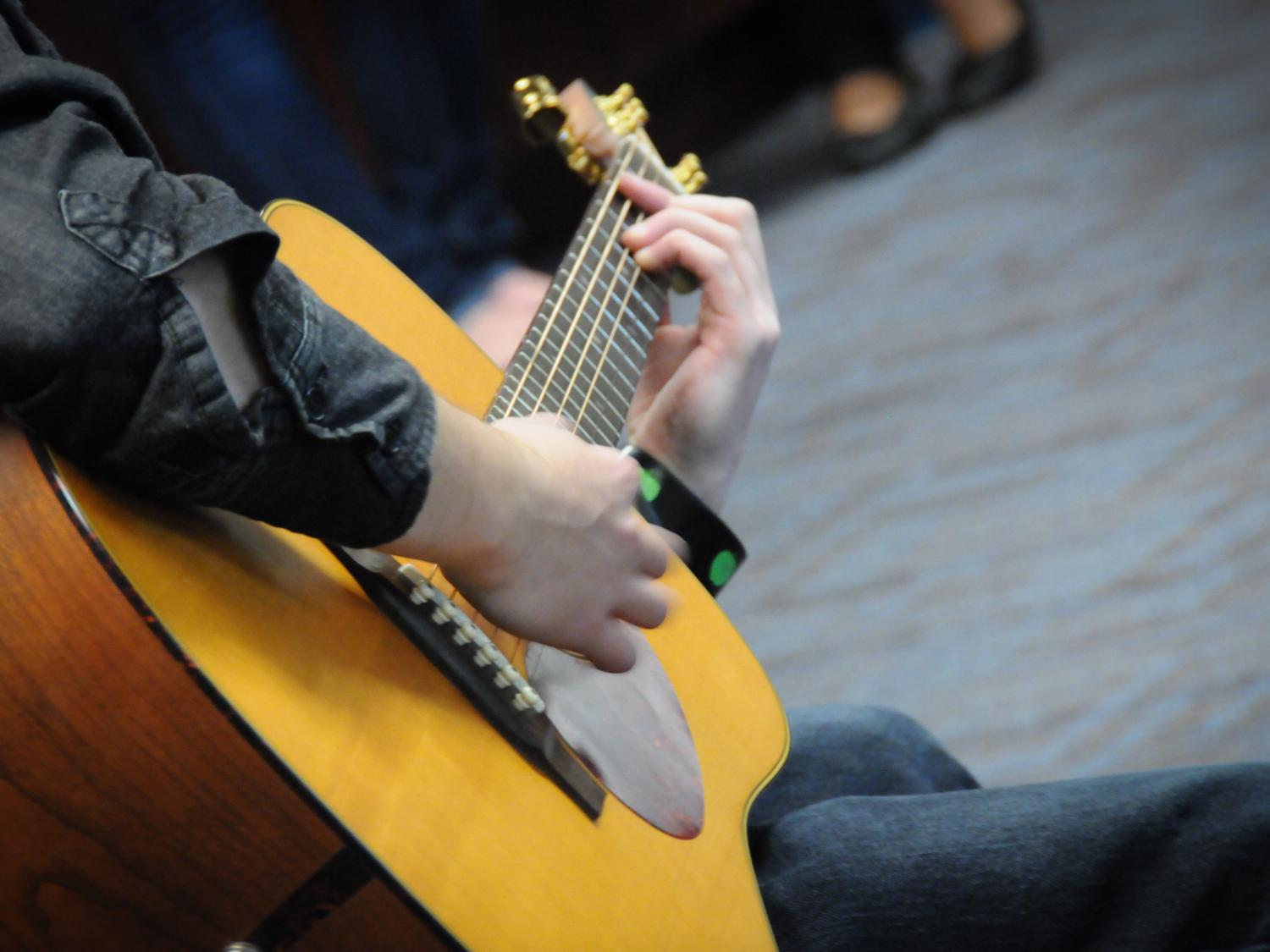  A Lehigh Valley student plays guitar during a campus performance.