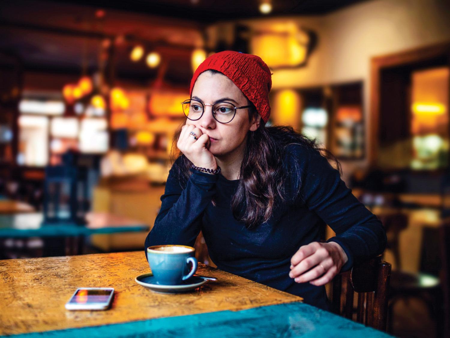 Young woman sitting at a table