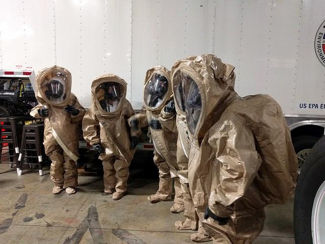 CDC interns in HAZMAT suits