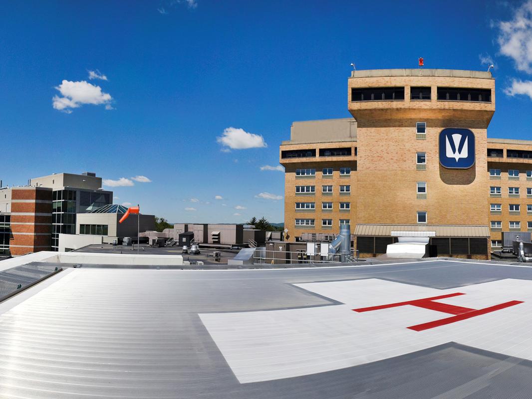 From the vantage point of a rooftop helipad, the Holy Spirit Hospital bed towers rise to the right while the Ortenzio Heart Center is at left.