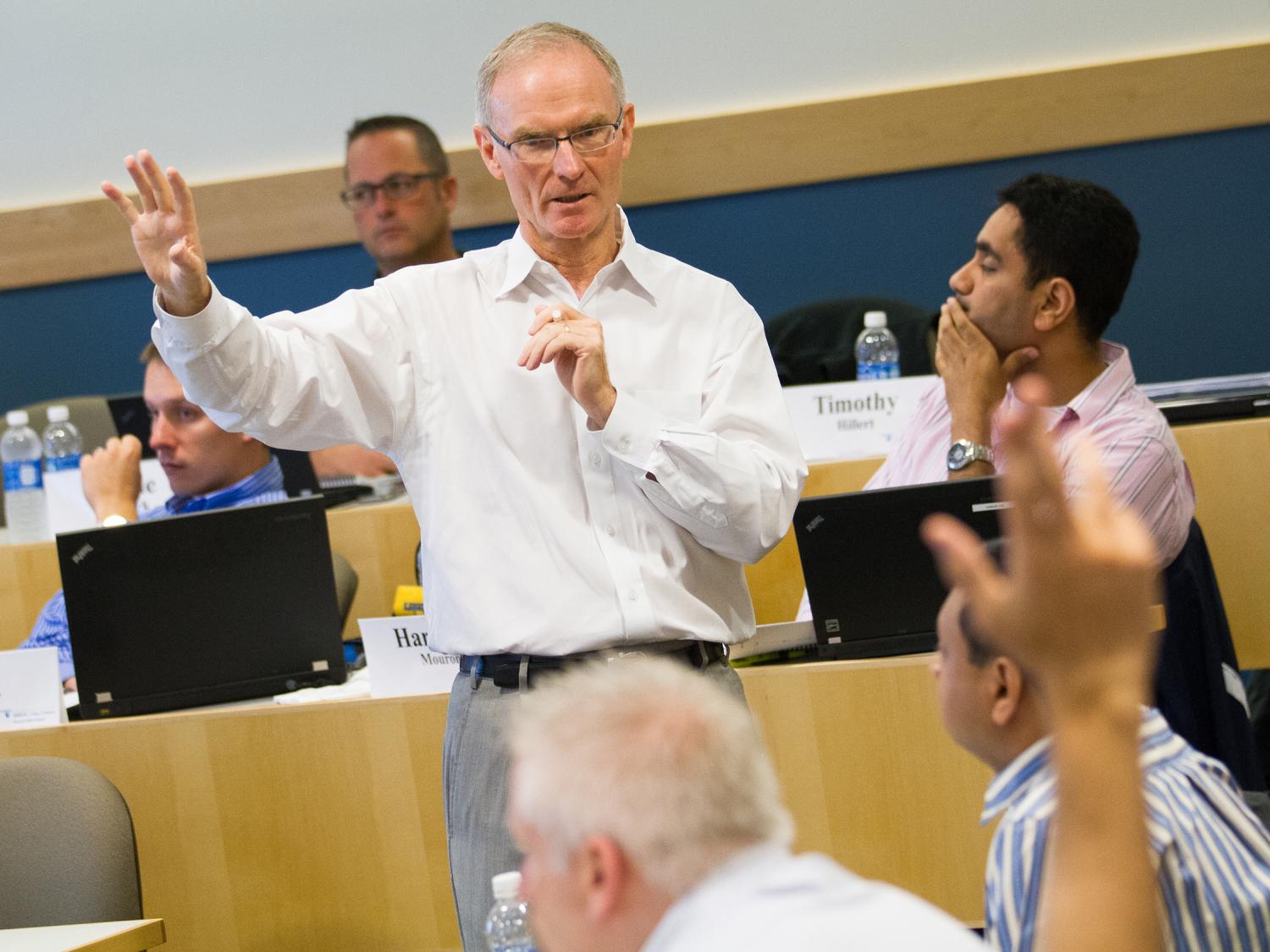Don Hambrick gestures during class.