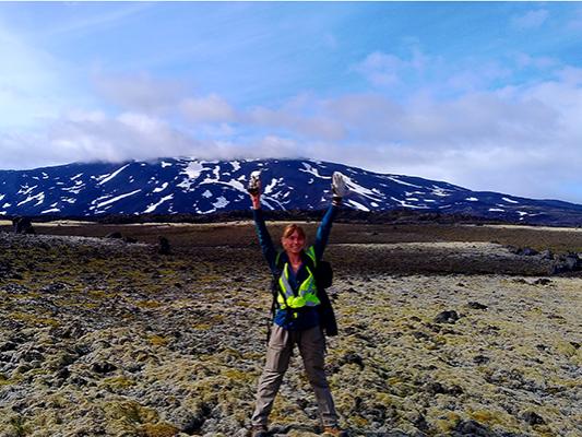 Penn State undergraduate student Catherine Hanagan at the location of a volcano in Iceland 