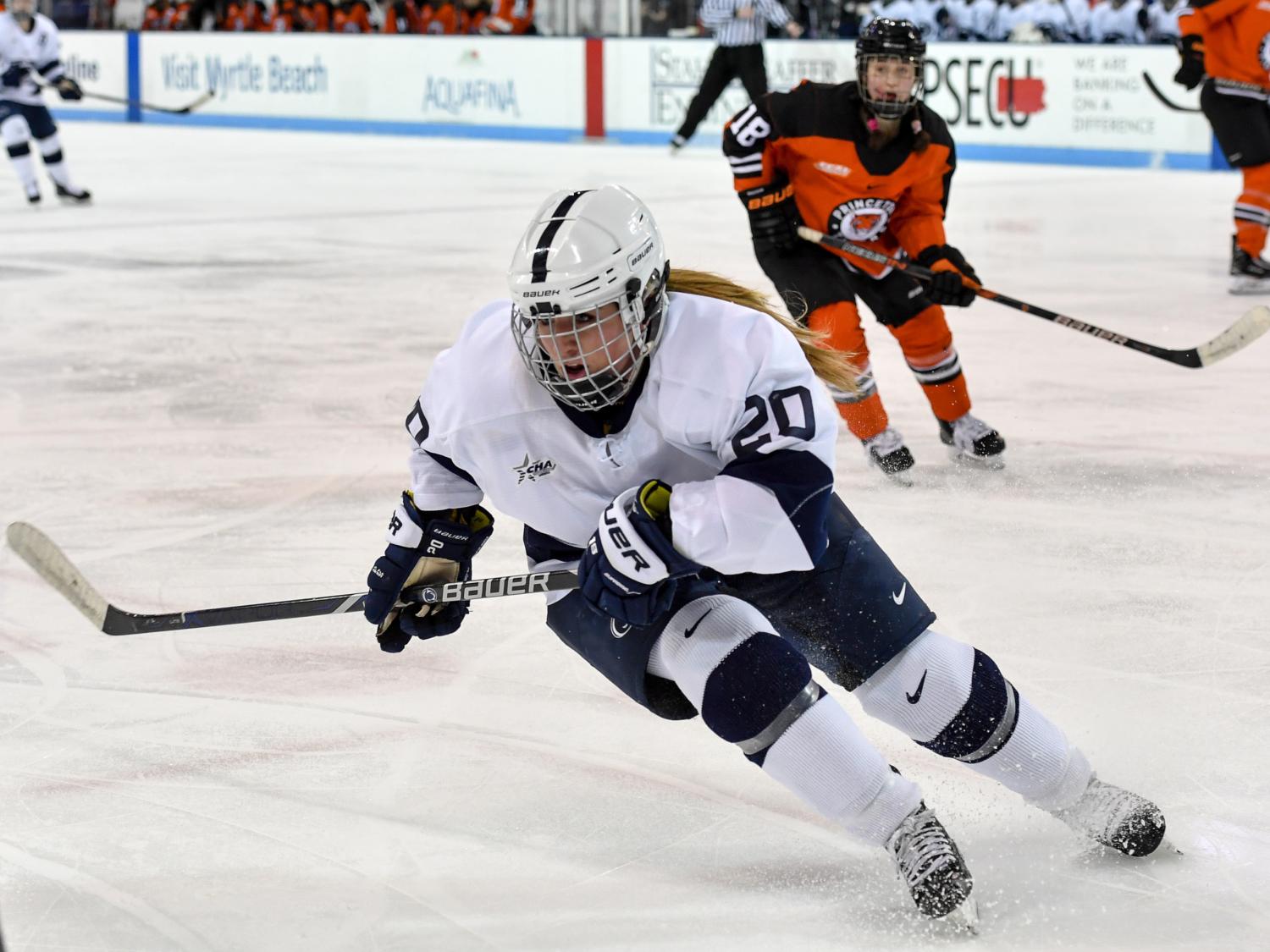 women playing ice hockey