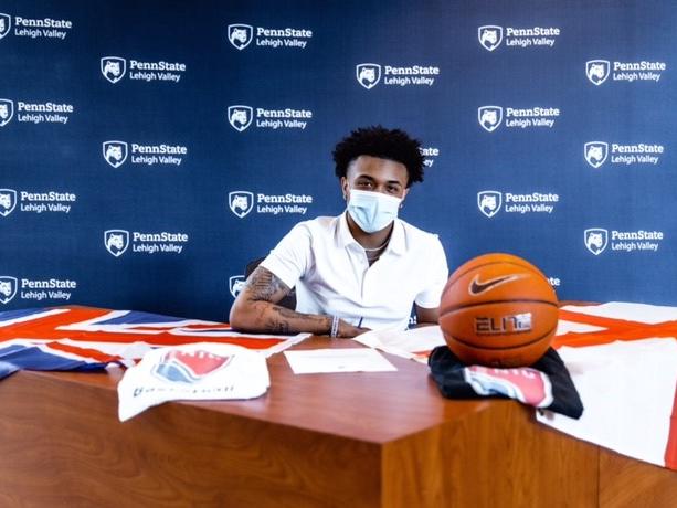 An athlete signing a document