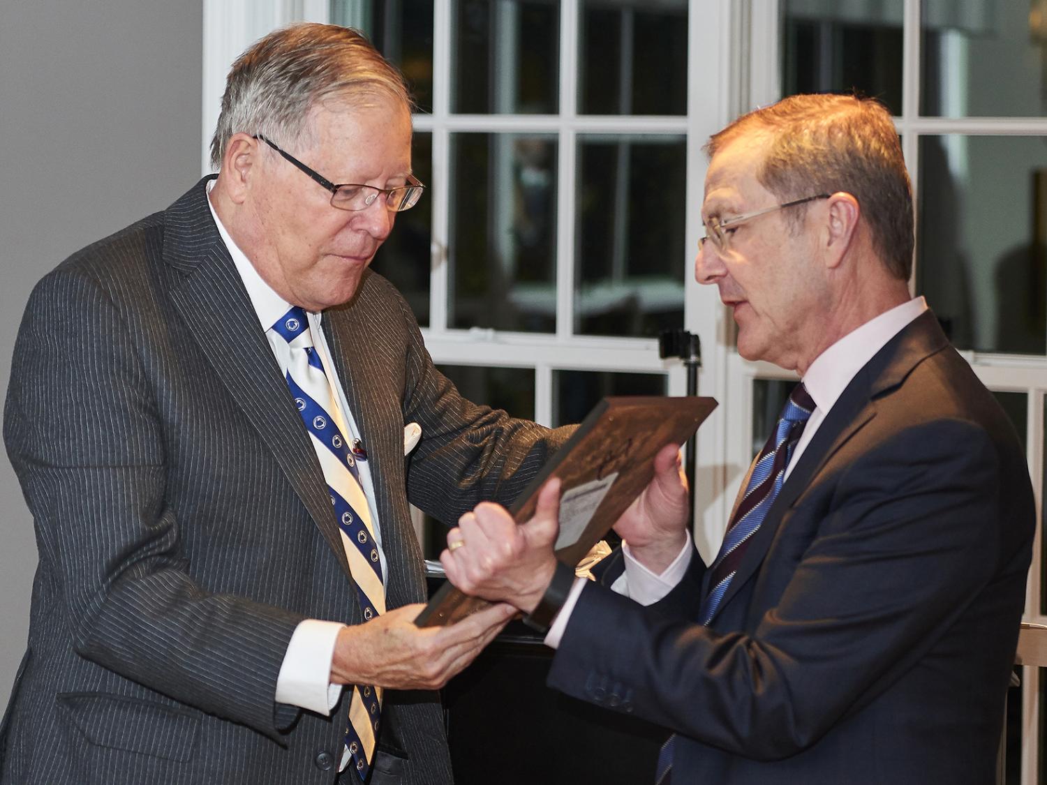 Dean Whiteman presents an award to Ed Hintz