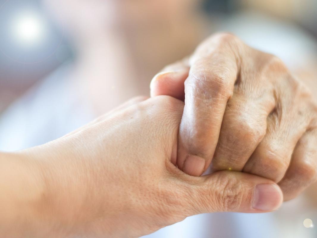 Close up of people holding hands