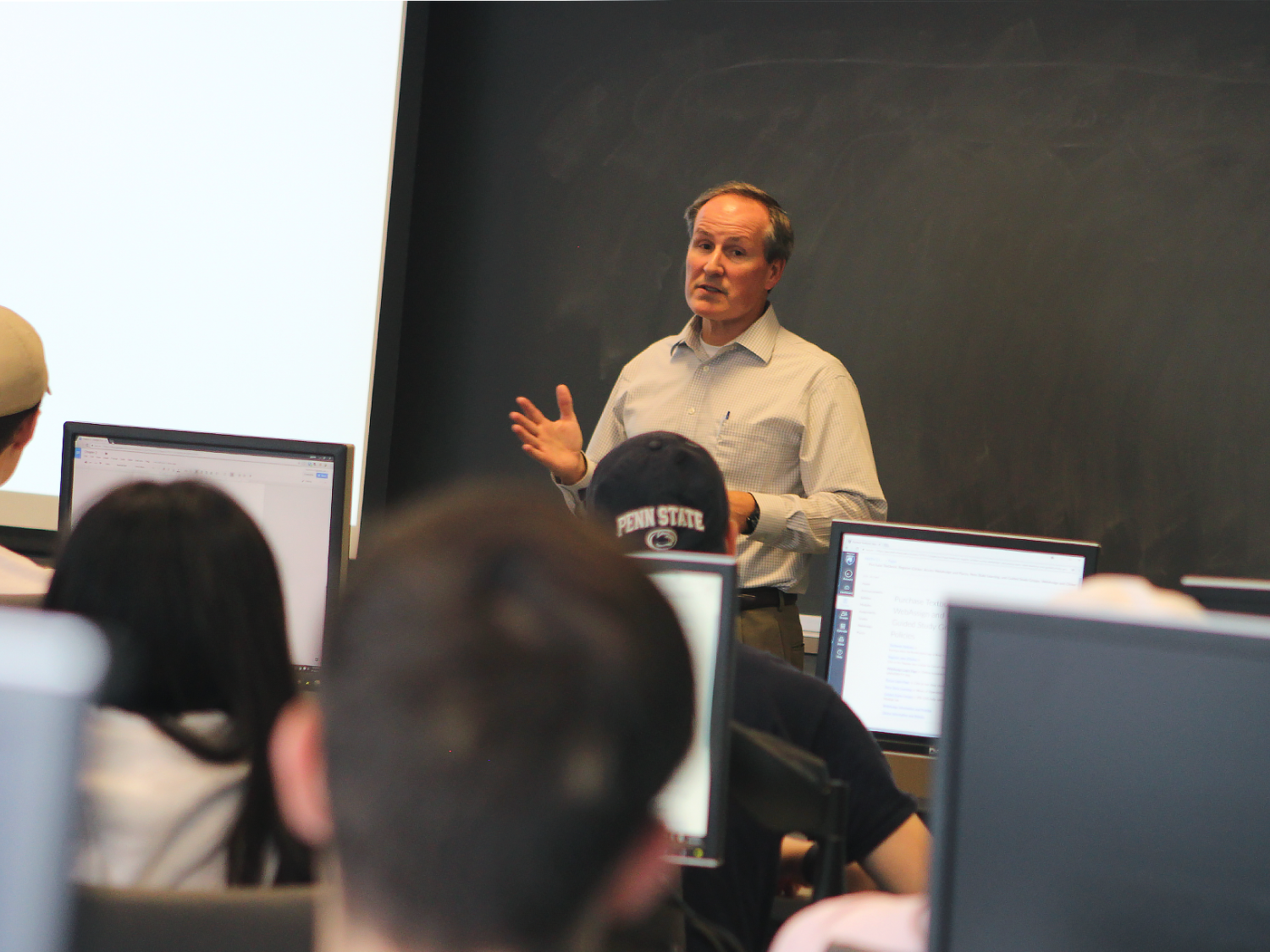 David Hozza, lecturer in the College of IST, teaching in a classroom.