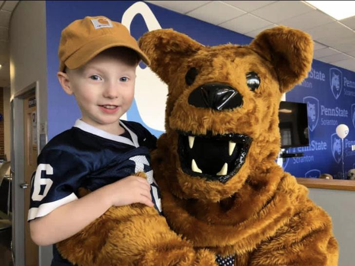 little boy with Nittany Lion at the Breakfast with the Nittany Lion