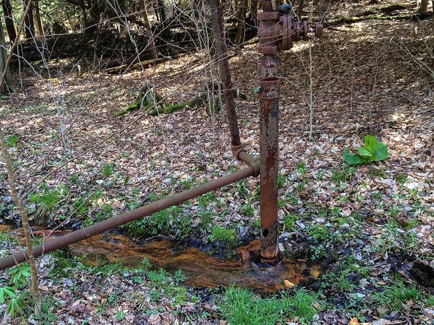 rusty pipe creating a well head