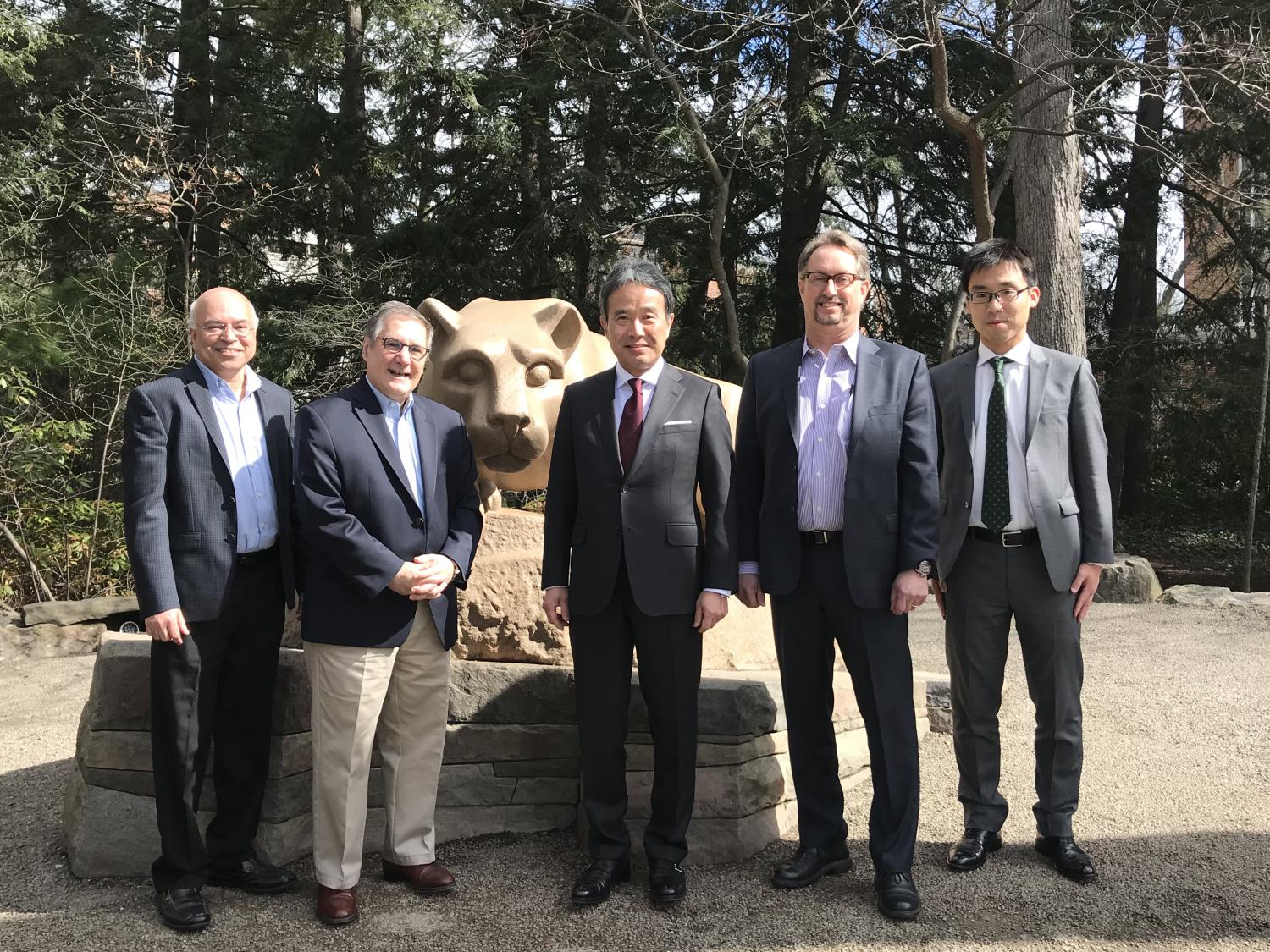Masahiko Mori (center) visits the Lion Shrine during his visit to Penn State. 