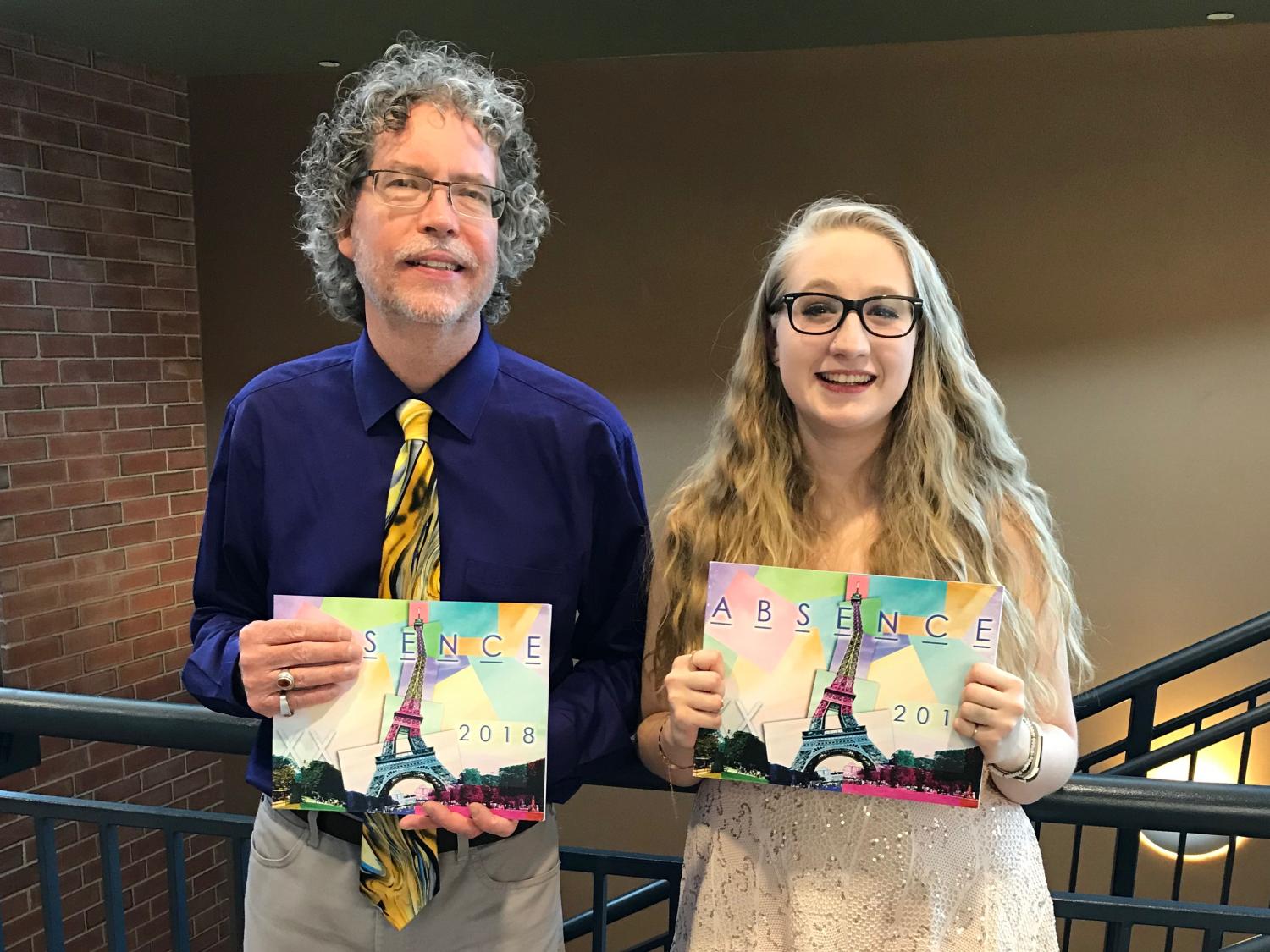 Dr. Clifford Manlove (Left) and Loren Baseler (Right) holding the 20th issue of ABSENCE