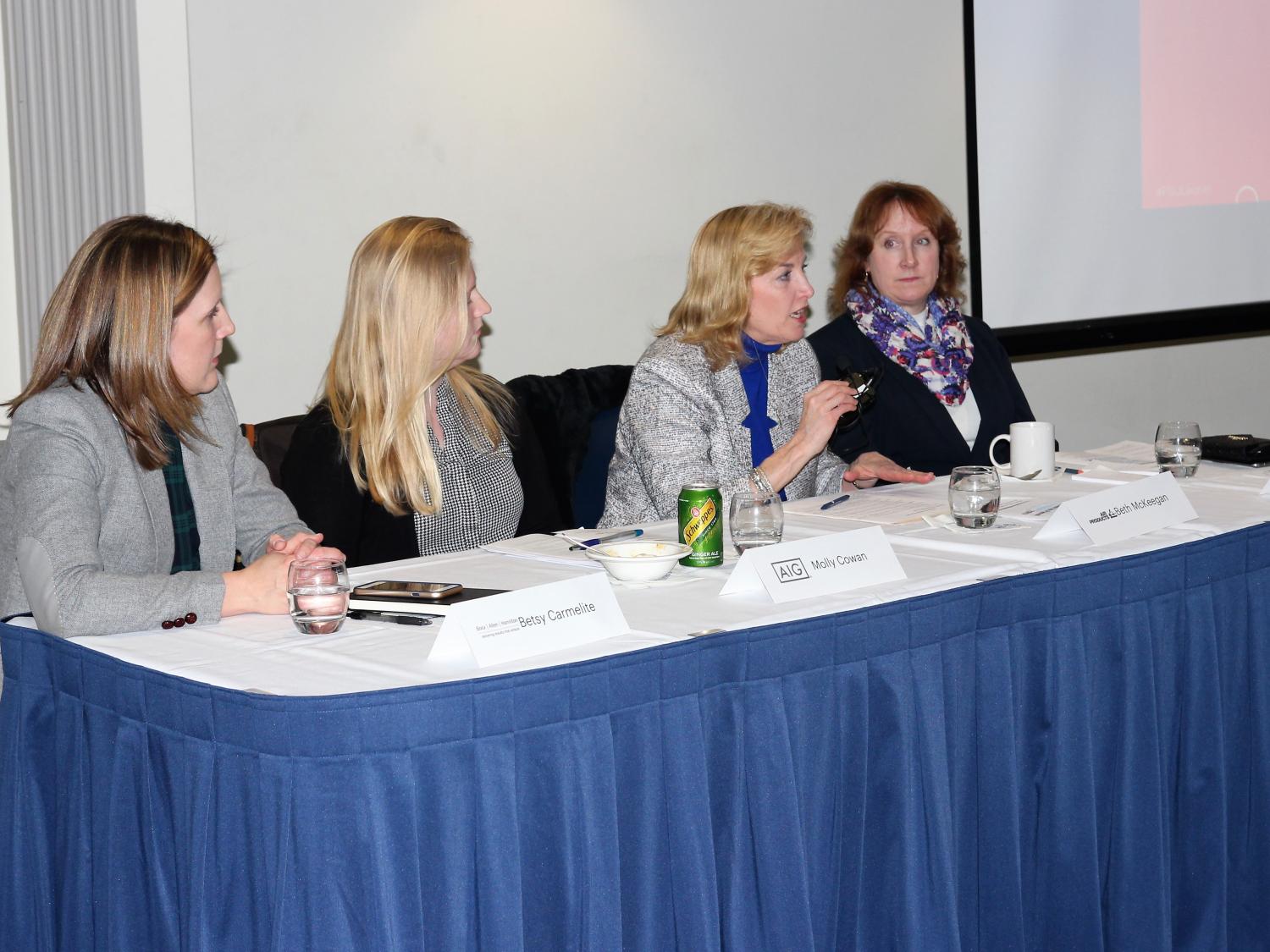 Professionals working in the technology sector address a group of students on a "Lean In" panel. 