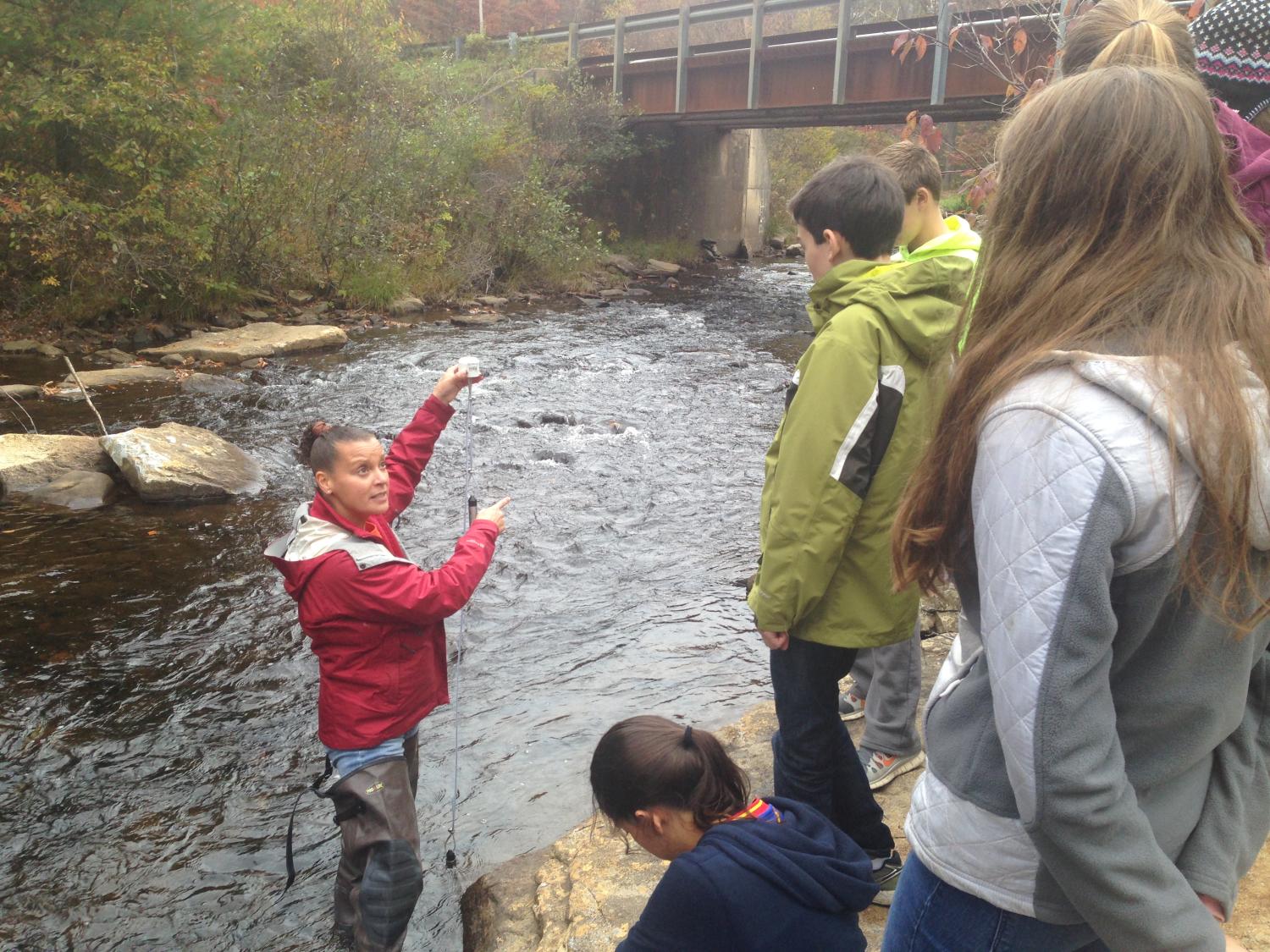 Penn State researcher Jennifer Williams leads high school students in the field 