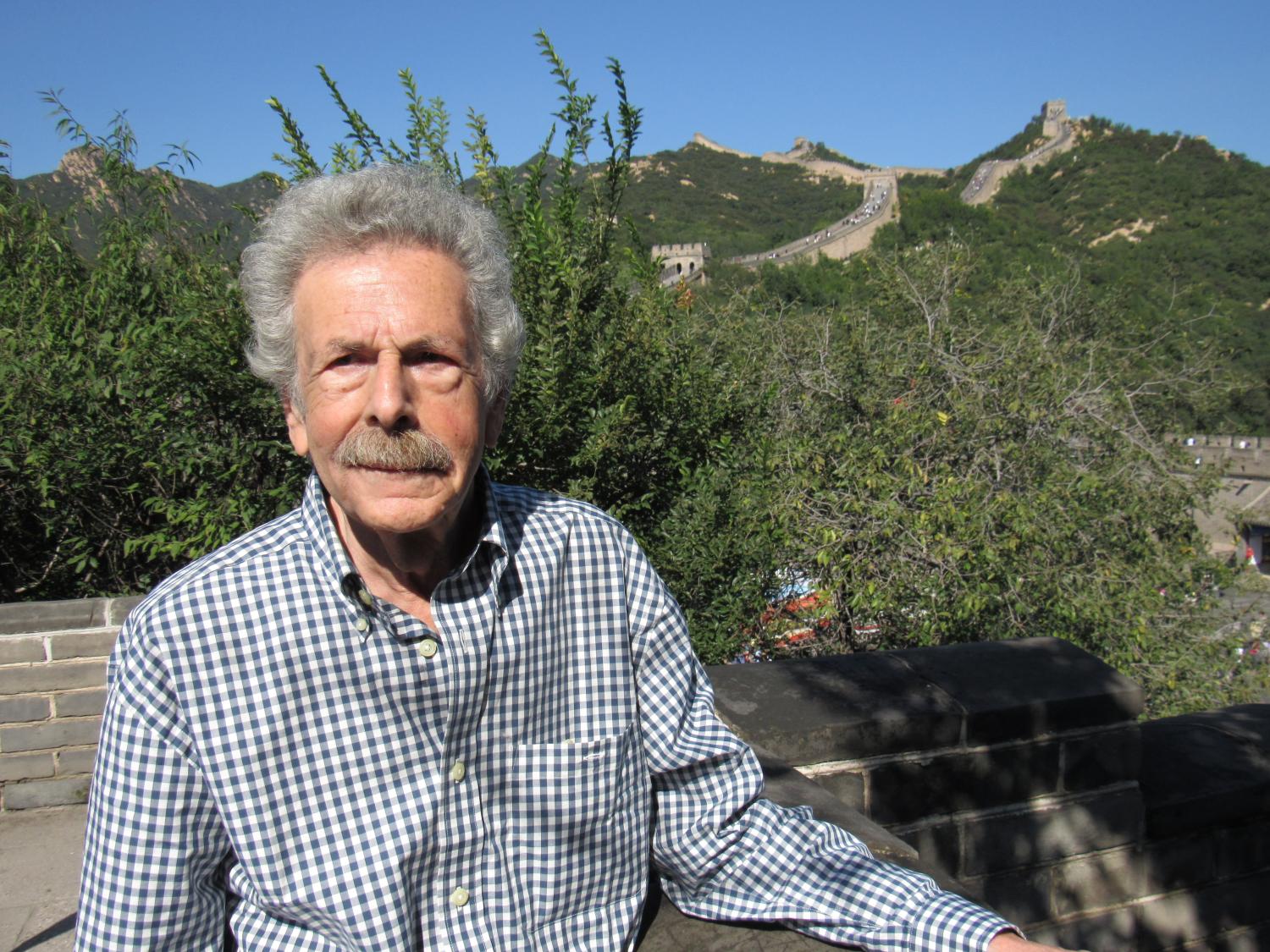 Dr. Anthony Cutler stands in front of The Great Wall of China. 