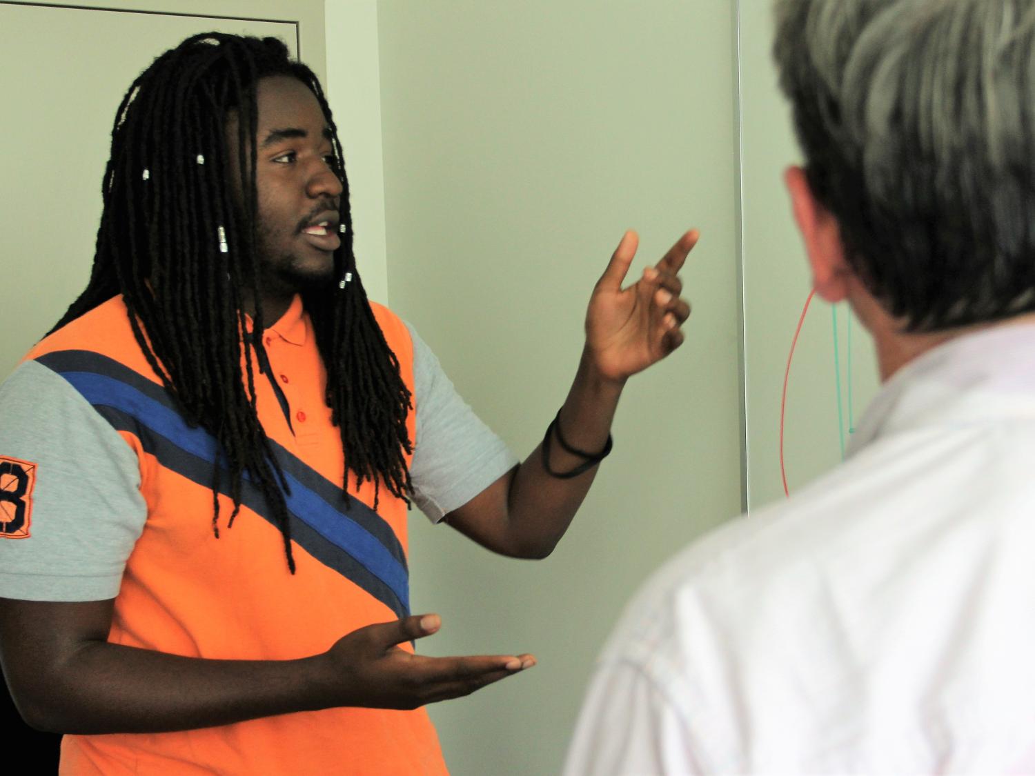 IST student Zion Emanuel discusses a research project with associate professor Stephen Haynes. 