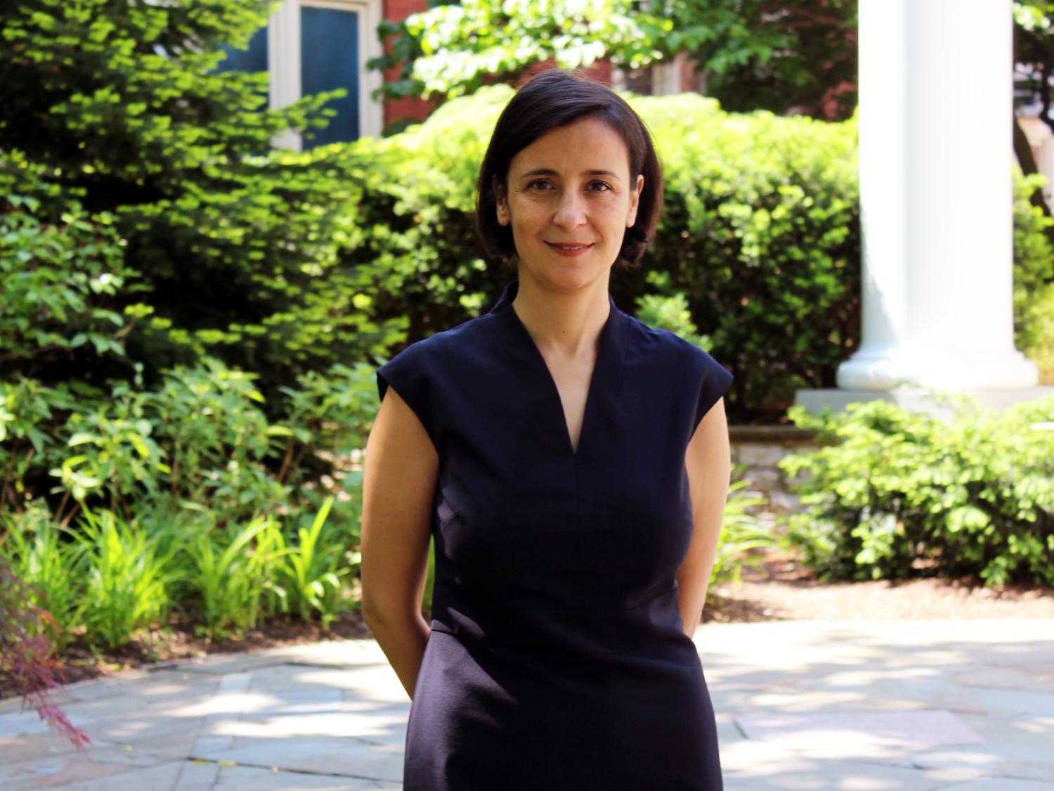 Sez Atamturktur stands outside the Hintz Alumni Hall