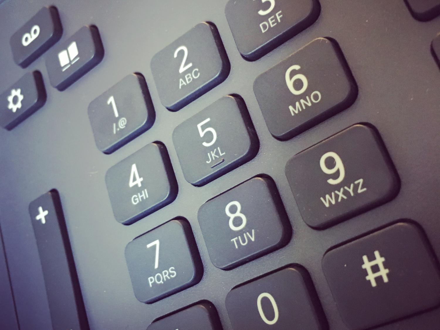 A close-up photo of a telephone's keypad