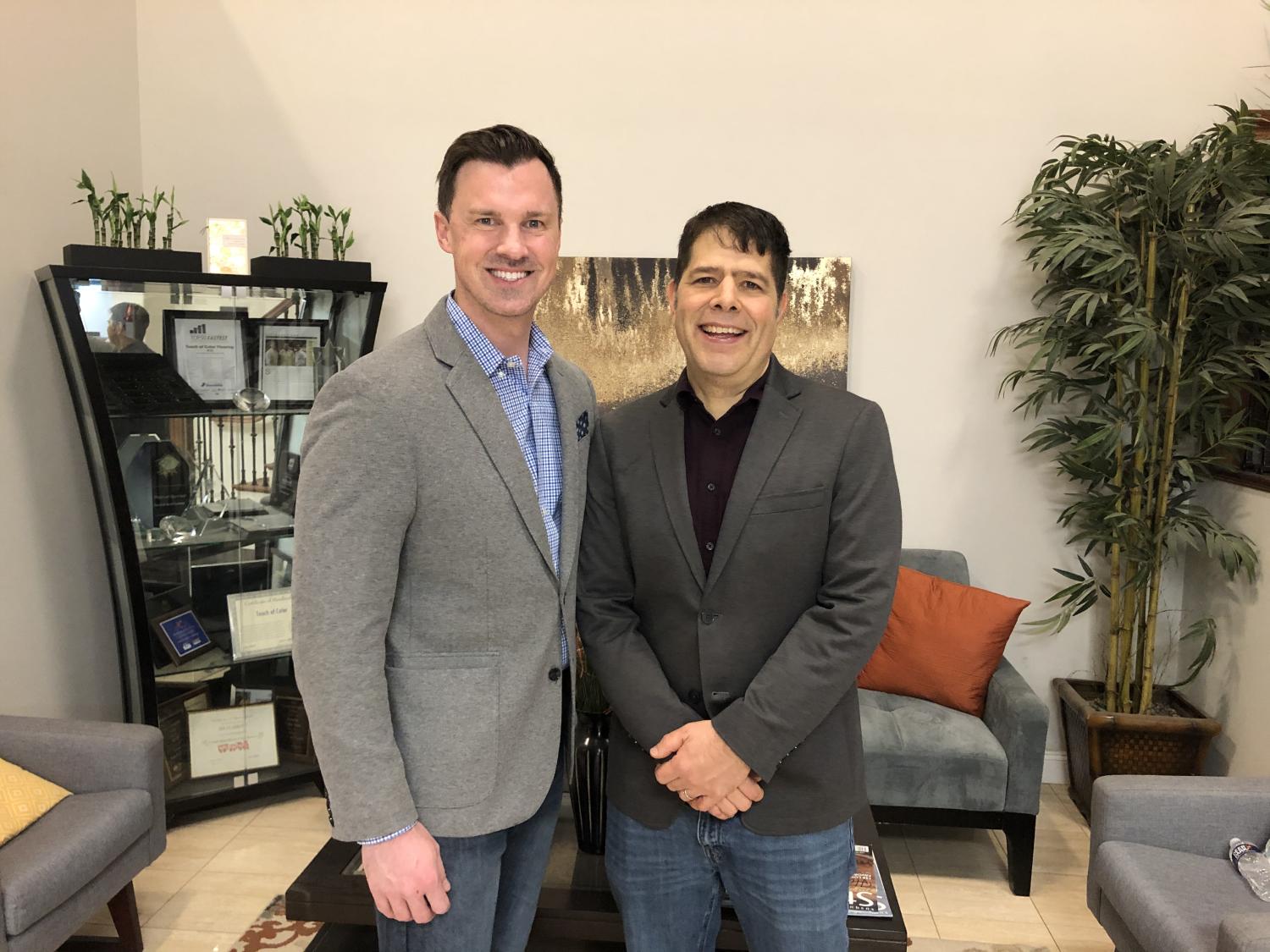 Jerry Bankes standing next to Scott Appel inside one of their Touch of Flooring locations