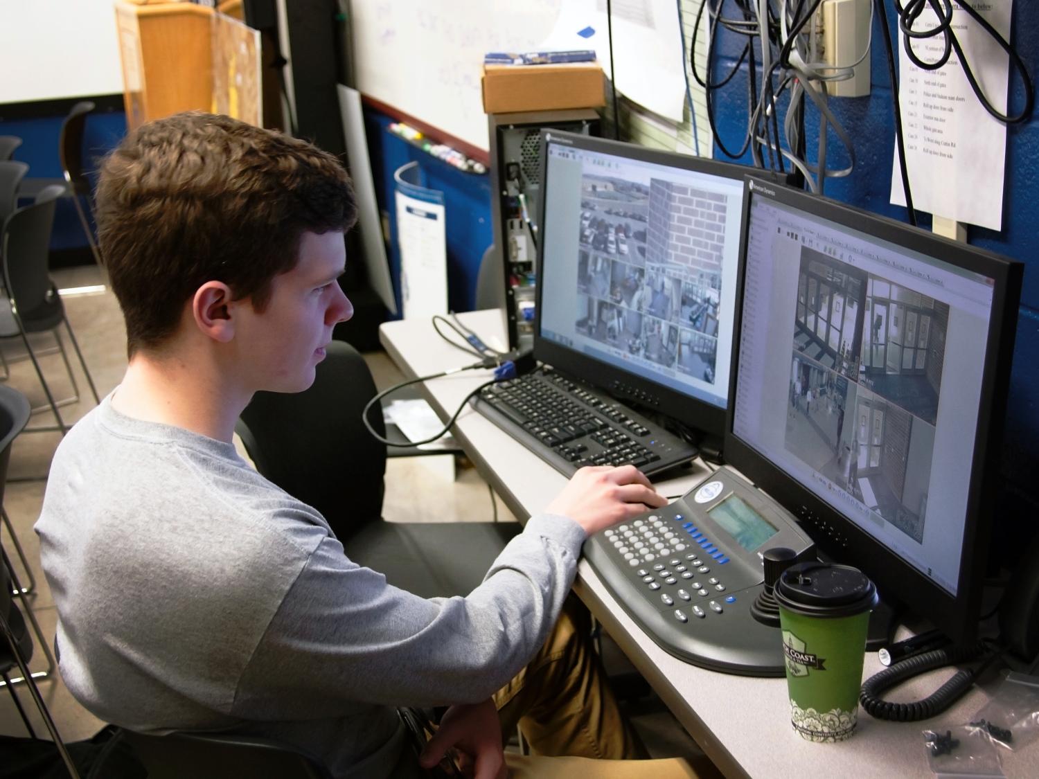 Michael Lubas views security camera footage from the Bryce Jordan Center. 
