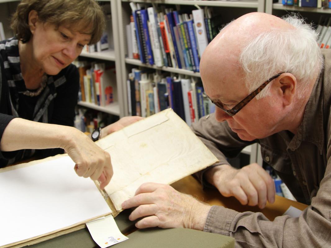 Perkins Foss and Sandra Stelts examine the binding