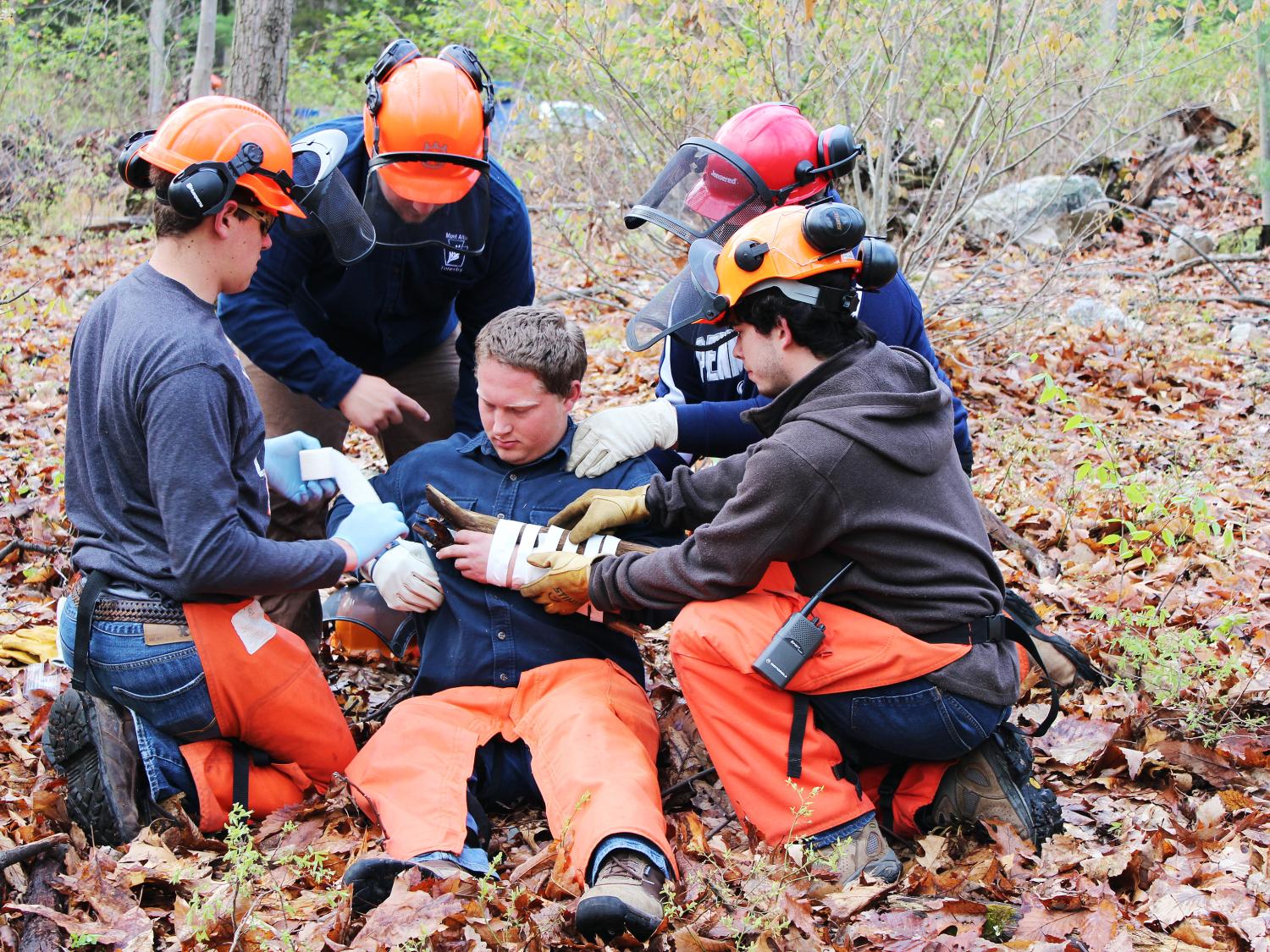 Penn State Mont Alto forest technology students provide first aid during trauma-scenario training event.