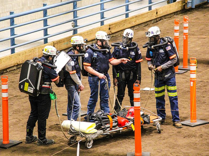 The Penn State Mount Nittany Mine Rescue Team works it way through the mock mine hazards