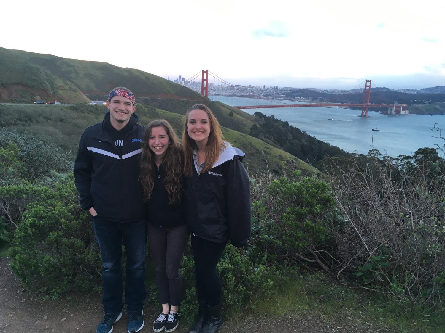 Helen Mendenhall, center, stands with Patrick Kress, left, and Alex Laffey during Penn State Behrend's Alternative Spring Break (ASB) trip to Oakland last semester. 