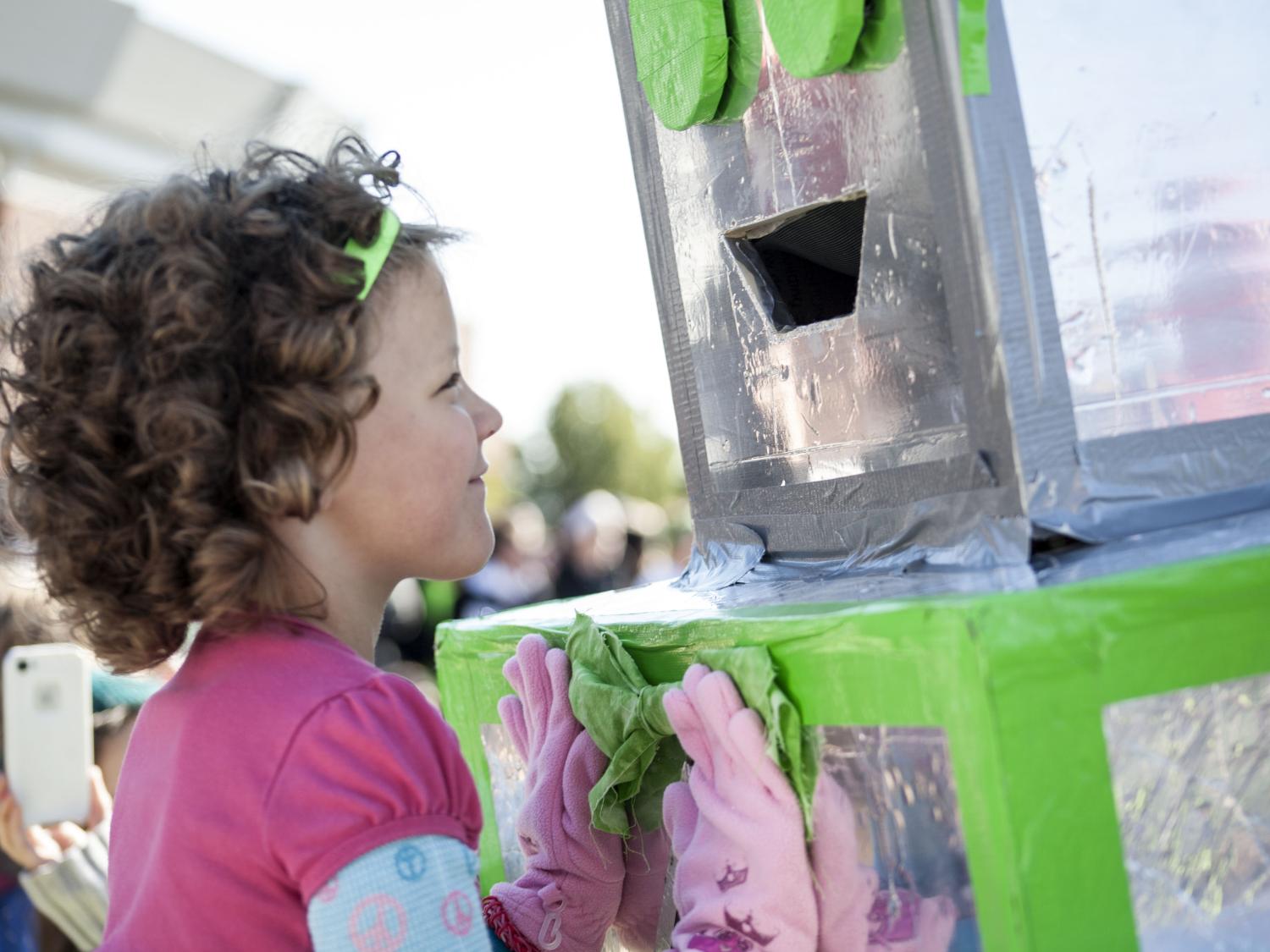 Child and technology committee robot mascot at a THON event