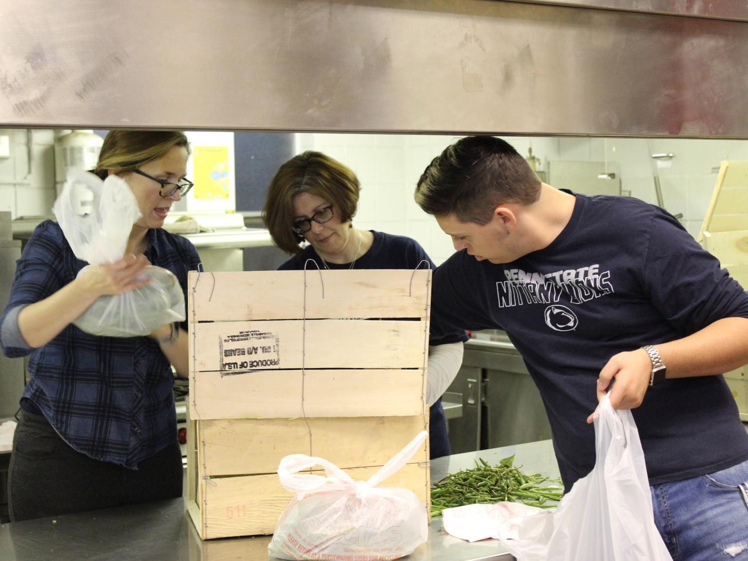 Employees packing food into bags