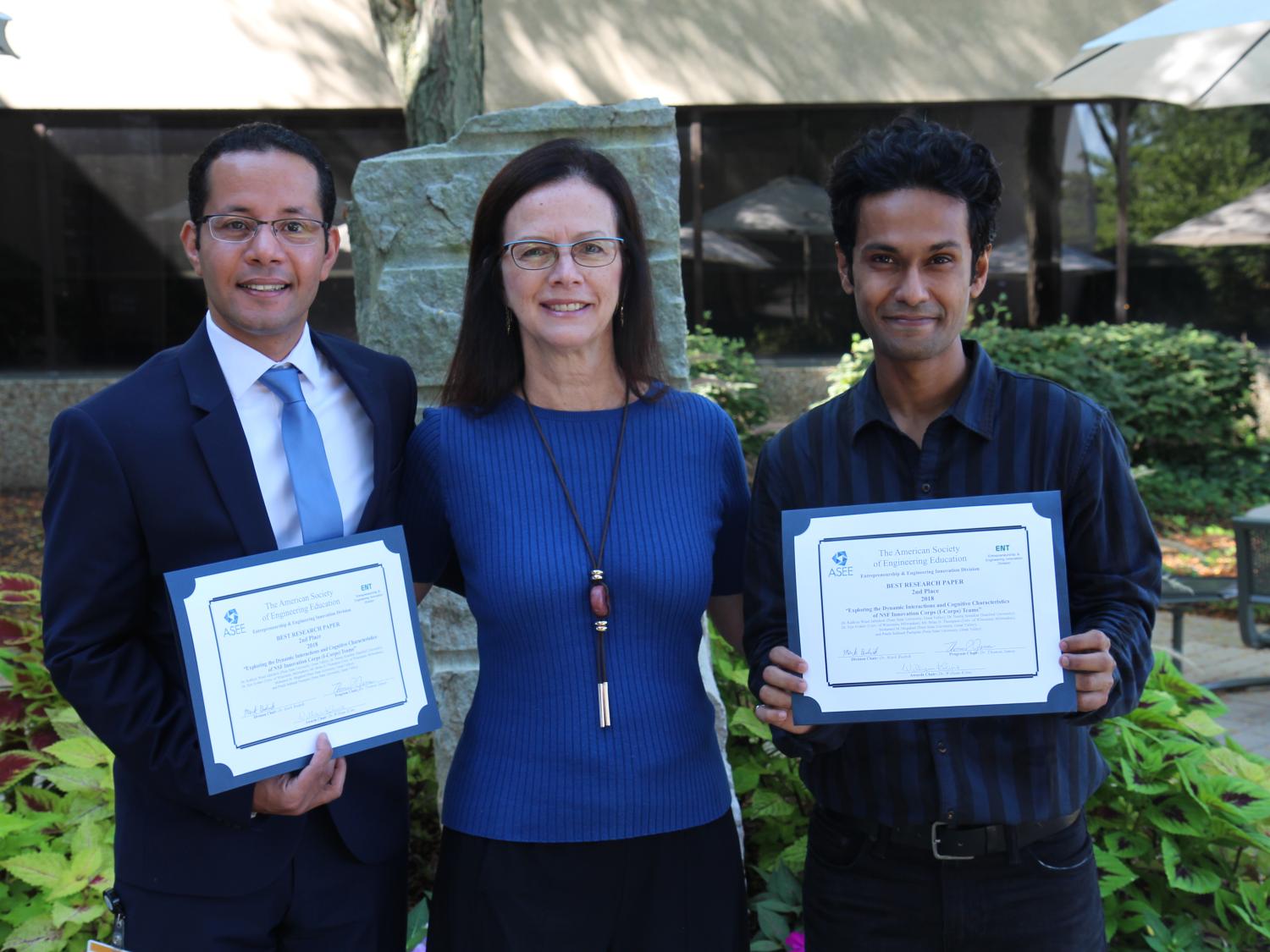 Penn State Great Valley graduate students Mohamed Megahed and Pratik Pachpute show off their ASEE awards with professor Kathryn Jablokow