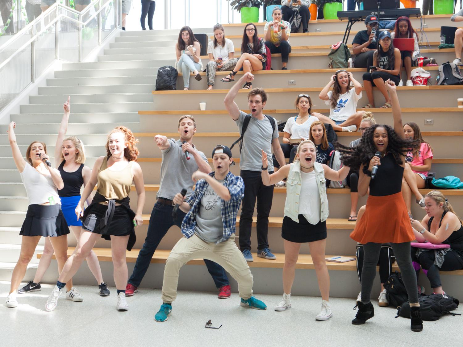 The cast finishes their song. 