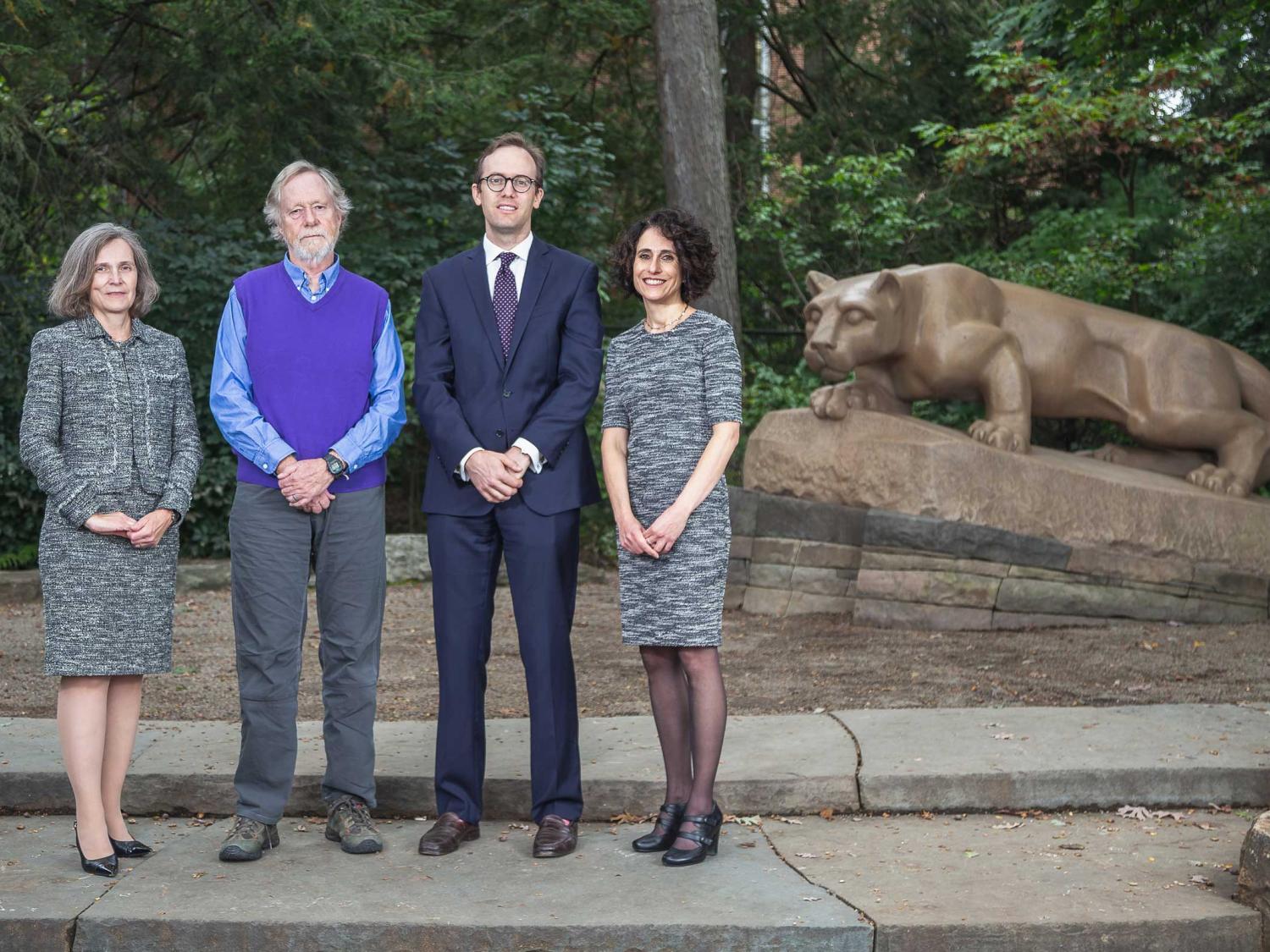Four alumni at the lion shrine