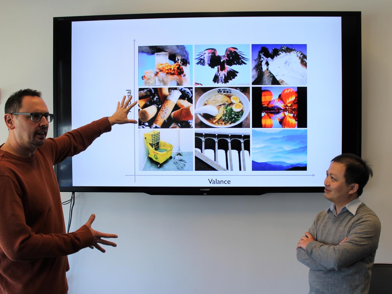 Dr. James Wang and Dr. Reginald Adams discussing a new patent that takes the next step in computer learning techniques in the hopes that computers can one day understand the complex realm of human feelings.