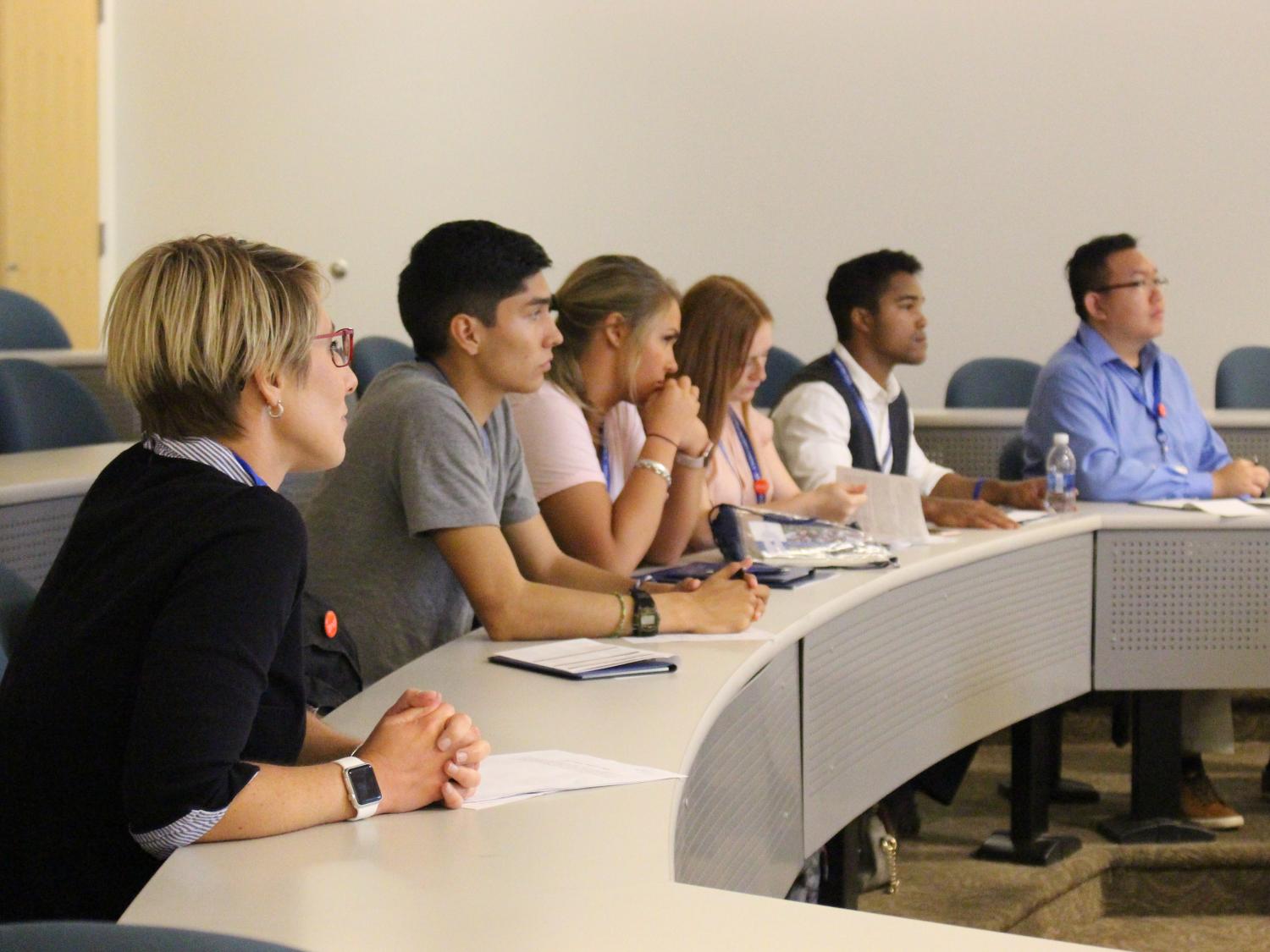Students listening to presentation during Lead the Pride