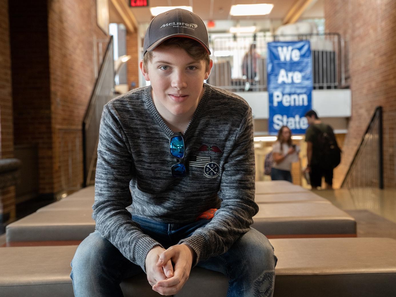 Mack Adams sits in lobby of New Kensington campus